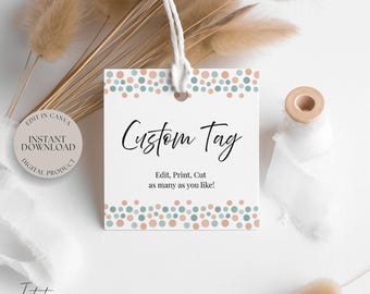 May include: A white custom tag with a string, featuring the text "Custom Tag" in elegant script. The tag is decorated with a dotted border in shades of blue and peach. The text "Edit, Print, Cut as many as you like!" is also included.