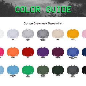 May include: Color guide for a cotton crewneck sweatshirt. The guide shows 24 different color options for the sweatshirt, including white, ash, sport grey, graphite heather, sand, gold, light pink, heliconia, orange, red, purple, maroon, heather sport royal, navy, light blue, carolina blue, irish green, military green, forest, dark heather, and black.