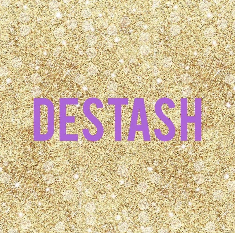 May include: A gold glitter background with the word "DESTASH" in purple block letters. The background has a sparkling effect with small, white, circular highlights.
