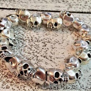 Eclectic detailed silver plated solid metal skull beaded elastic bracelet