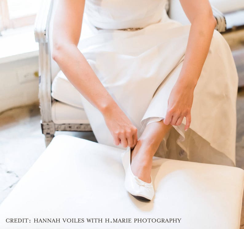 white foldable ballet flats