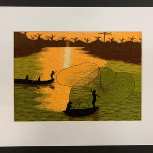 May include: A colorful embroidered artwork depicting a sunset scene with three figures in a boat casting a net in a lake. The artwork features a vibrant orange and yellow sunset sky, a green lake, and brown trees in the background.