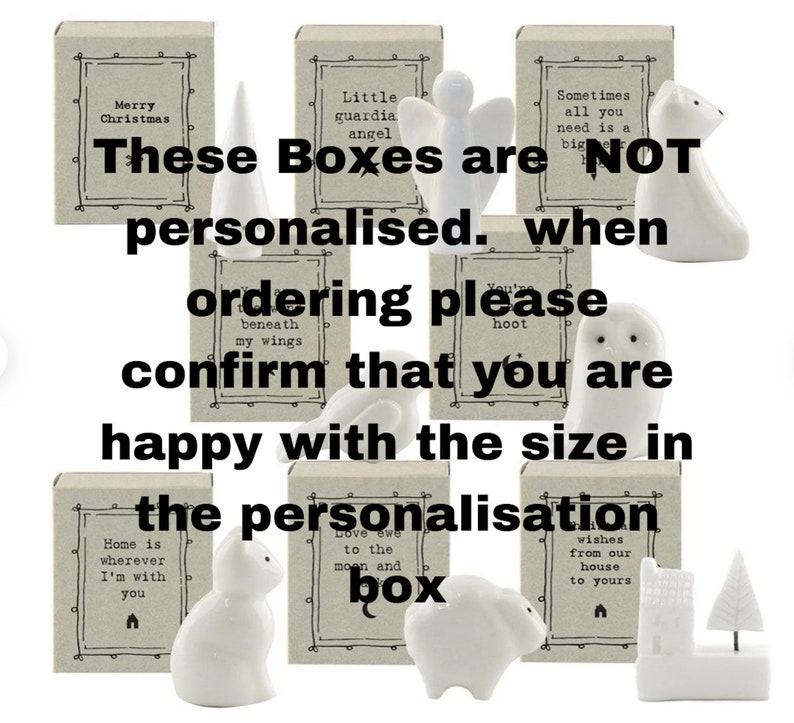 May include: A collection of white ceramic figurines, including an angel, owl, polar bear, and cat, each paired with a small box. The boxes have text such as "Merry Christmas" and "Home is wherever I'm with you". The text on the image says "These Boxes are NOT personalised."