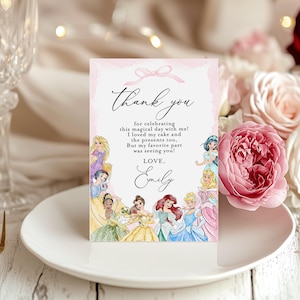 May include: A pink and white thank you card with a bow design at the top. The card features the text "Thank you" in elegant script, along with a message and the name "Emily." Princess illustrations surround the text.