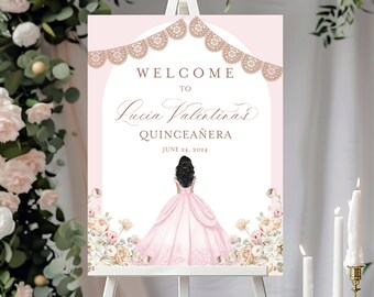 May include: A pink and white welcome sign for a Quinceañera. The sign features a floral design with a silhouette of a girl in a pink dress. The text reads "Welcome to Lucia Valentina's Quinceañera June 24, 2024".