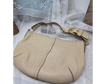 cream color coach purse