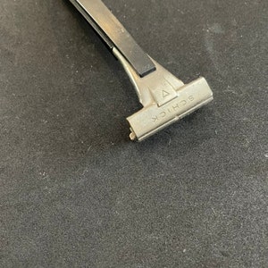 1970’s Vintage Schick M20 chrome and black disposable razor