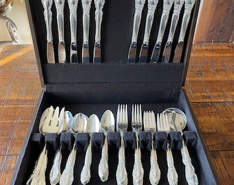 Beautiful vintage, 1995 Oneida Calilily silver flatware set in original brown box - would make a beautiful wedding gift!