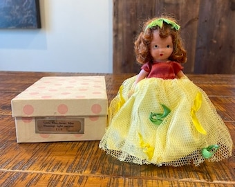 Vintage 1940s Nancy Ann Storybook doll, Little Miss, Sweet Miss #110, red hair, rust petticoat, yellow tulle green/yellow ribbons, 6” tall.