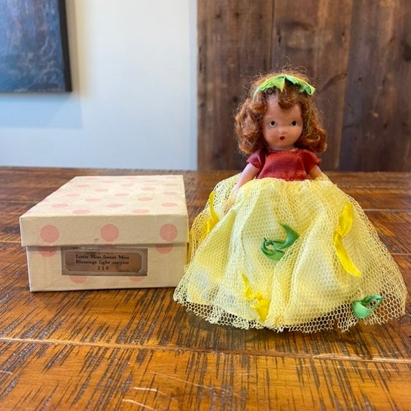 Vintage 1940s Nancy Ann Storybook doll, Little Miss, Sweet Miss #110, red hair, rust petticoat, yellow tulle green/yellow ribbons, 6” tall.