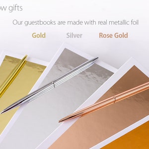 May include: Three pens with gold, silver, and rose gold finishes are laid on top of matching colored paper. The text "Our guestbooks are made with real metallic foil" is above the pens. The words "Gold", "Silver", and "Rose Gold" are written below the pens.
