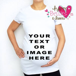 May include: White maternity t-shirt with the text "YOUR TEXT OR IMAGE HERE" printed on the front. The shirt has a pink heart with the text "happy Bellies & babies" on the right shoulder.