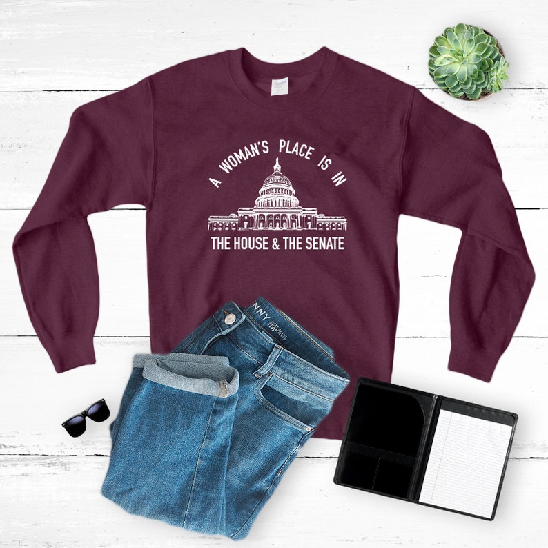 a woman's place is in the house and the senate sweatshirt