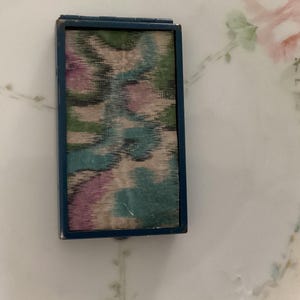 May include: A set of three ceramic mugs with a speckled, matte finish. The mugs are in shades of cream, light gray, and dark gray. Each mug has a simple, minimalist design, perfect for coffee or tea.