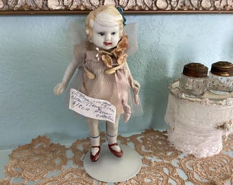 REDUCED! Antique, 7” Bisque pin Jointed Girl Doll in Original Clothes with Doll Stand, Tag on Doll from previous Owner,