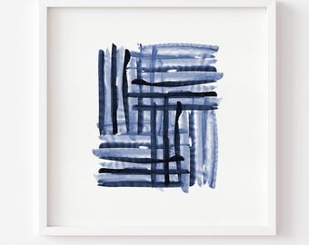 May include: Abstract watercolor art print in a white frame. The artwork features a grid-like pattern of blue and navy brushstrokes on a white background. The brushstrokes vary in thickness and create a textured effect. The artwork is a modern piece.