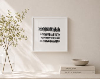 May include: A framed abstract art print featuring four horizontal black brushstrokes on a white background. The artwork is displayed in a white frame. The image is part of a minimalist home decor theme.