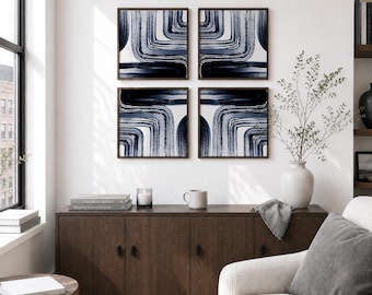 May include: Four framed abstract art prints. Each print features a navy blue and white design with curved lines. The frames are dark brown. The artwork is displayed above a dark wood cabinet in a living room setting.