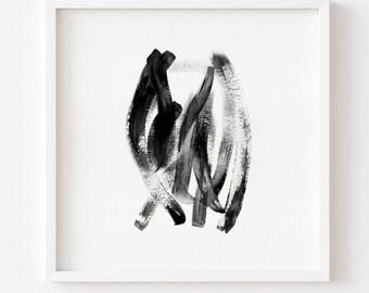 May include: Abstract black and white artwork in a white frame. The painting features bold brushstrokes creating a dynamic, swirling composition. The artwork is a modern piece suitable for home or office decor.