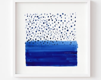 May include: Abstract art print in a white frame. The artwork features a dark blue horizontal band at the bottom, with a lighter blue dotted pattern above. The text at the bottom reads "Print comes Unframed (no frame or matt included)".