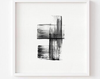 May include: Abstract black and white artwork in a white frame. The artwork features bold brushstrokes forming a geometric design. The composition includes horizontal and vertical strokes, creating a modern aesthetic.