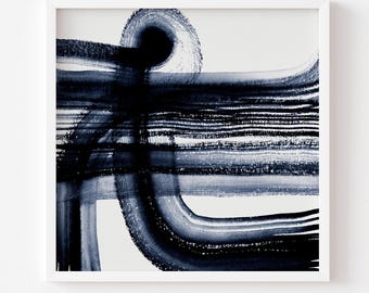 May include: Abstract art print in a white frame. The artwork features bold, dark blue brushstrokes on a white background. The design includes curved and horizontal lines, creating a dynamic composition. The print is unframed.