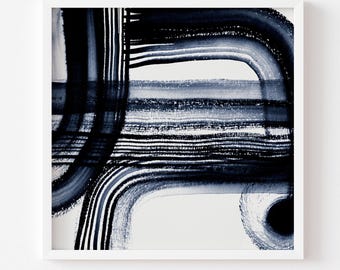 May include: Abstract art print in a white frame. The artwork features bold, navy blue brushstrokes and lines on a white background. The print includes curved and straight lines, creating a modern, minimalist design. The text at the bottom says "Print comes Unframed (no frame or matt included)".