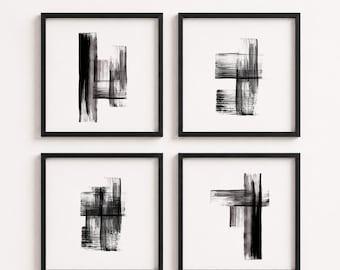 May include: A set of four square wall art pieces, each featuring black ink brush strokes on a white background, enclosed in thin black frames. The abstract designs consist of vertical and horizontal lines with varying textures and opacities.