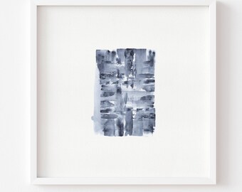 May include: A square white frame containing an abstract painting with dark blue and grey watercolor brushstrokes. The artwork features a vertical arrangement of horizontal and vertical marks, creating a textured, layered effect on a white background.