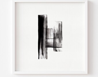 May include: Abstract black and white artwork in a white frame. The art features bold brushstrokes creating vertical and horizontal shapes. The painting is a minimalist design, suitable for modern home decor.