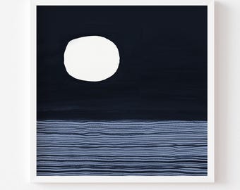 May include: A square art print featuring a dark navy blue night sky with a large, solid white circular moon. The lower portion of the print displays a textured sea composed of horizontal lines in varying shades of blue and dark navy.