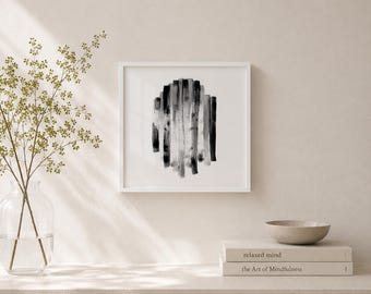May include: A framed abstract art print featuring vertical brushstrokes in shades of gray and black. The artwork is displayed in a white frame, creating a minimalist aesthetic. The print is part of a home decor collection.