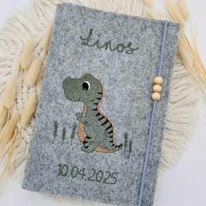 Personalisierte U-Heft Hülle aus Filz / Dino T-Rex / Name / Geburtsdatum / Auswahl an 11 Filzfarben und 7 Schriftarten / Untersuchungsheft