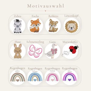 May include: A selection chart titled Motivauswahl featuring twelve circular embroidered patches. Designs include a zebra, fox, fawn, lion, rabbit, butterfly, goose, ladybug, and four rainbows in olive, blue, pink, and purple with small hearts.