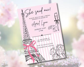 May include: Pink bridal shower invitation with the text "She said oui!" featuring a black and white Eiffel Tower illustration, a champagne glass, and a croissant. The invitation includes event details and floral accents.