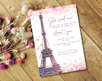 May include: A bridal shower invitation featuring the Eiffel Tower and pink hearts. The invitation reads "She said oui!" and includes details for a shower in honor of April Lynn on August 21st, 2025.