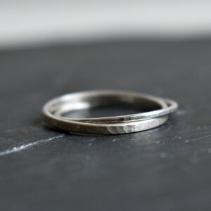 Interlaced engagement rings made of silver.