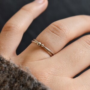 Silver ring for woman. fine and modern hammered ring with 2 interlace rings. image 4