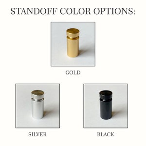May include: Three standoffs in gold, silver, and black. Standoffs are used to mount signs, plaques, and other objects to a wall.