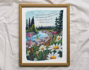 Peut inclure: Peinture à l'aquarelle d'une scène de forêt avec une rivière qui la traverse. La peinture présente une citation de la Bible : « Cherchez d'abord son royaume et sa justice, et toutes ces choses vous seront données. Matthieu 6 :33 »