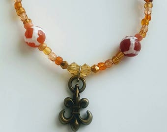 Orange beaded chain, Beaded chain, orange beads, orange necklace, casual necklace, beaded necklace, Fleur de lis necklace, fleur de lis