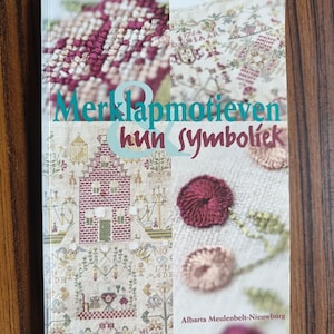 BOEKvoorbeeldmotieven en hun symboliek, kaartpatronen, lettermotieven, Nederlandse editie, windmolens, kunstboeken met naalden, Nederlandse folklore