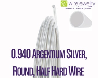 May include: A coil of 0.940 Argentium silver round, half hard wire. The wire is silver in color and is coiled in a circle.