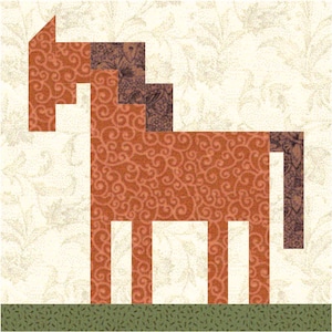 May include: A brown horse quilt block with a brown and purple mane and tail. The horse is standing on a green field.