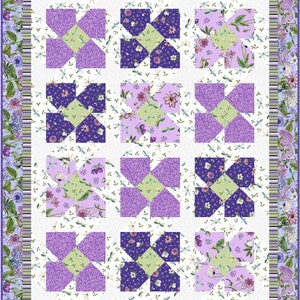 May include: A purple and green quilt block pattern with a white background. The quilt blocks are arranged in a grid pattern and feature a floral design with dragonflies.