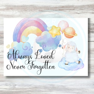 May include: A whimsical illustration featuring a rainbow, clouds, and a sheep holding balloons. The text "Always Loved Never Forgotten" is written in elegant script. The artwork has a soft, pastel color palette, creating a gentle and comforting feel.