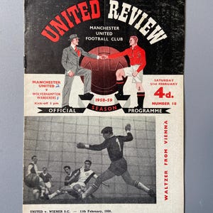 May include: A vintage Manchester United Review programme from the 1958-59 season. The cover displays illustrations of two men shaking hands over a football, with the text "UNITED REVIEW". Includes a black and white photo of a football match.