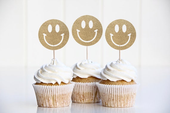 Set a fun, retro emoji party table with an All Smiles Smiley Face Birthday  Party Supply Kit for 16 Guests. The kit has a table cover, 2 sizes of  plates, and napkins
