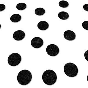 May include: Black confetti circles scattered on a white background.