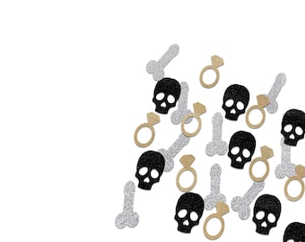 May include: A collection of glittery confetti pieces scattered on a white background. The confetti features black skulls, silver penises, and gold diamond rings. The design has a fun and celebratory aesthetic.